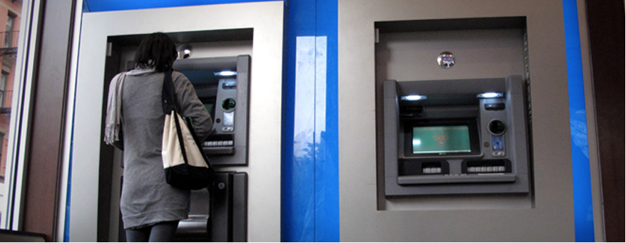 Woman Using ATM Machine